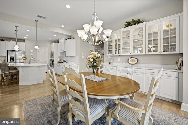 37546 Bella Via Way, Ocean View, DE 19970 - dining space with a chandelier, light wood finished floors, and recessed lighting