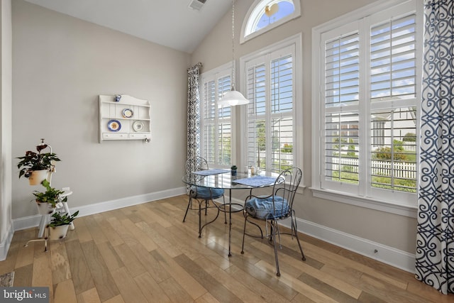 37546 Bella Via Way, Ocean View, DE 19970 - dining area with wood finished floors, lofted ceiling, healthy amount of natural light, and baseboards