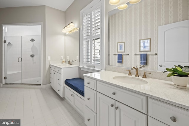 37546 Bella Via Way, Ocean View, DE 19970 - bathroom with a shower stall, two vanities, and tile patterned flooring