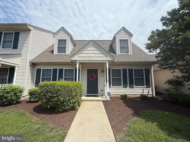 view of front of house with a shingled roof