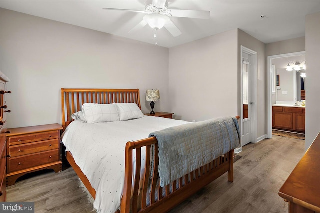 425 Lindenhurst Ct, Salisbury, MD 21804 - bedroom with light wood-type flooring, ceiling fan, ensuite bathroom, and a sink