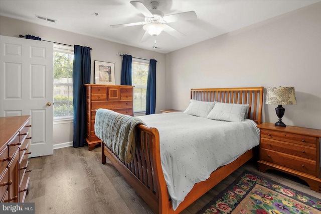 425 Lindenhurst Ct, Salisbury, MD 21804 - bedroom with light wood finished floors, multiple windows, and a ceiling fan