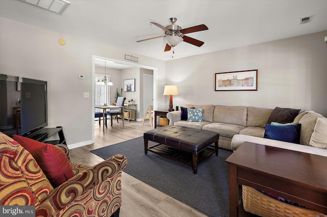 425 Lindenhurst Ct, Salisbury, MD 21804 - living room featuring ceiling fan, wood finished floors, and a chandelier