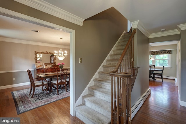 12 Meadow Woods Ln, West Grove, PA 19390 - stairway with a baseboard heating unit, wood finished floors, ornamental molding, a chandelier, and baseboard heating