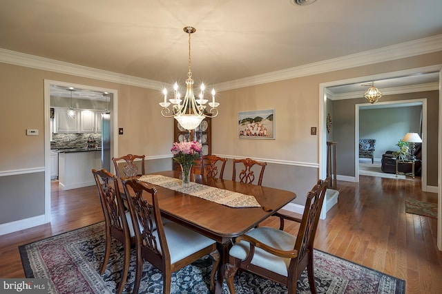 12 Meadow Woods Ln, West Grove, PA 19390 - dining area with a chandelier, wood finished floors, ornamental molding, and baseboards