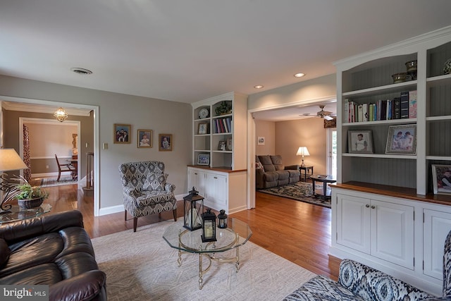 12 Meadow Woods Ln, West Grove, PA 19390 - living area featuring wood finished floors, a ceiling fan, and baseboards
