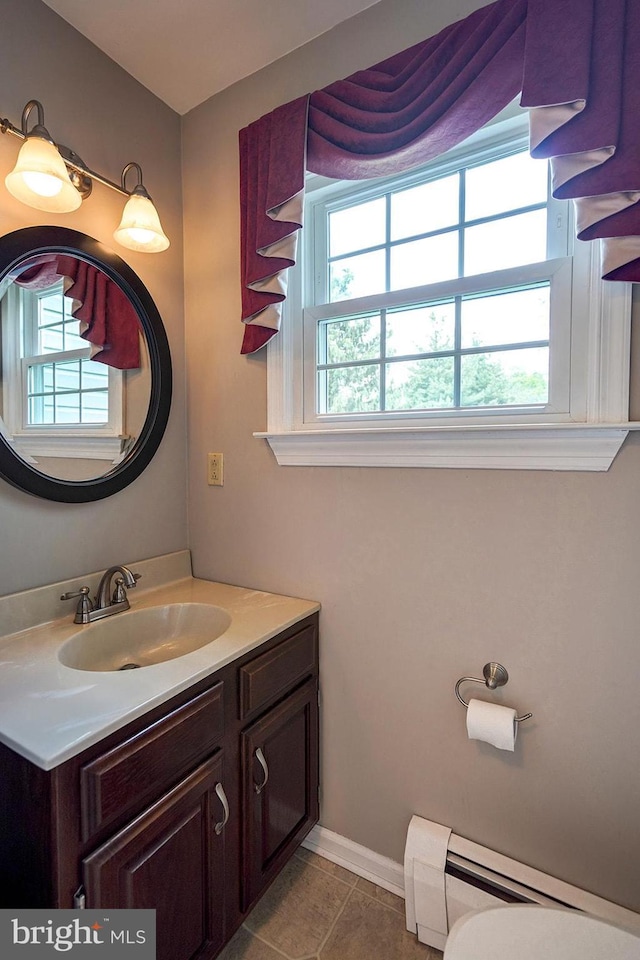 12 Meadow Woods Ln, West Grove, PA 19390 - bathroom featuring a baseboard heating unit, healthy amount of natural light, vanity, and tile patterned flooring