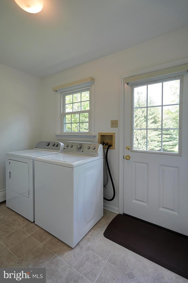 12 Meadow Woods Ln, West Grove, PA 19390 - washroom with washing machine and dryer and light tile patterned floors