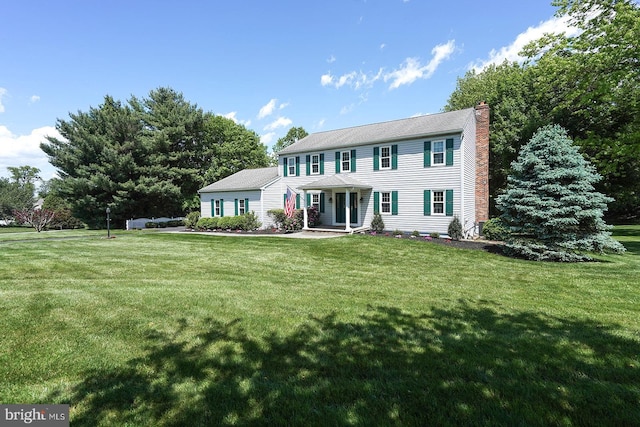 12 Meadow Woods Ln, West Grove, PA 19390 - colonial home featuring a front yard and a chimney