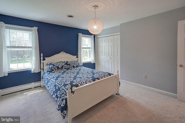 12 Meadow Woods Ln, West Grove, PA 19390 - bedroom with baseboard heating, carpet flooring, multiple windows, and a closet