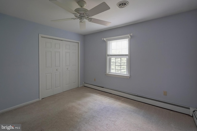 12 Meadow Woods Ln, West Grove, PA 19390 - unfurnished bedroom with a baseboard heating unit, carpet flooring, a closet, a ceiling fan, and baseboards
