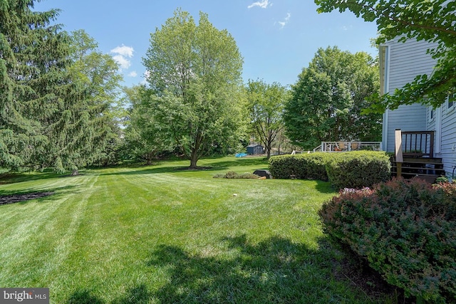 12 Meadow Woods Ln, West Grove, PA 19390 - view of grassy yard with a deck and view of scattered trees