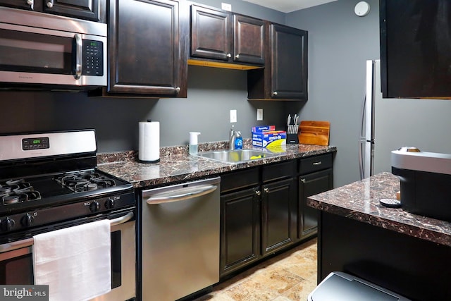 5538 Karen Elaine Unit 1625, Hyattsville, MD 20784 - kitchen featuring stainless steel appliances, dark stone counters, a sink, and stone finish floors