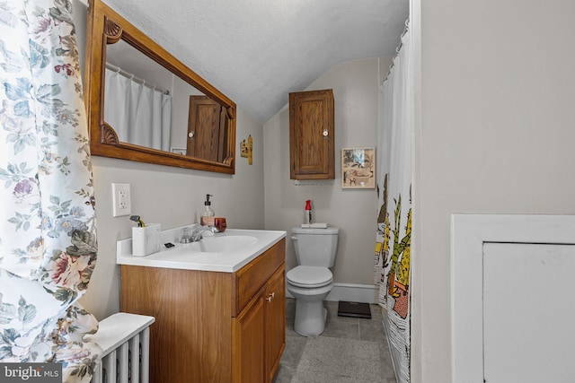 bathroom with lofted ceiling, vanity, toilet, tile patterned flooring, and a textured ceiling