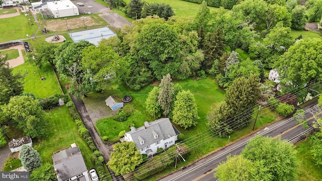 drone / aerial view of a tree filled landscape