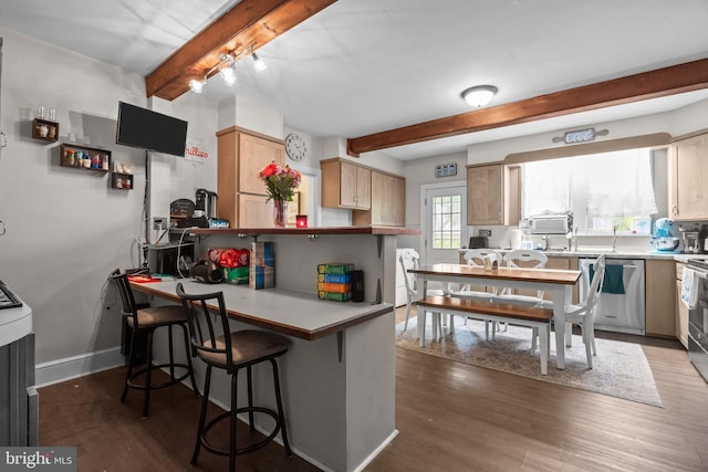 kitchen featuring stainless steel dishwasher, beamed ceiling, baseboards, light countertops, and dark wood-style floors