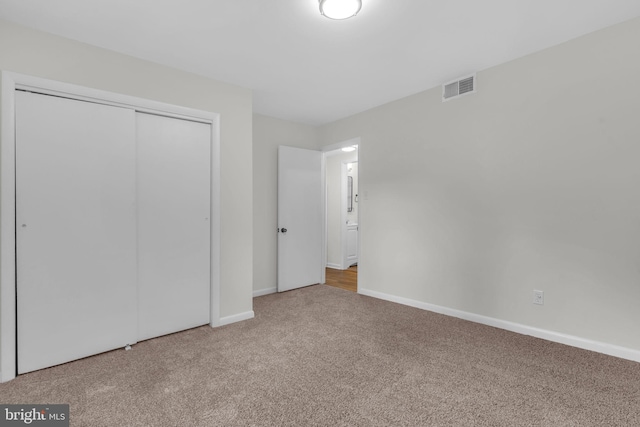 29823 Hillview Dr, Mechanicsville, MD 20659 - unfurnished bedroom featuring carpet floors, a closet, and baseboards