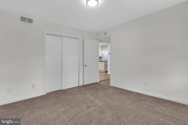 29823 Hillview Dr, Mechanicsville, MD 20659 - unfurnished bedroom featuring carpet, a closet, and baseboards