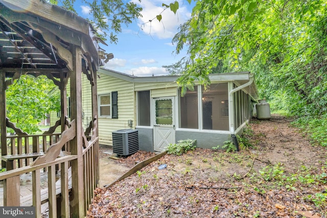 29823 Hillview Dr, Mechanicsville, MD 20659 - back of house with central AC unit and a sunroom