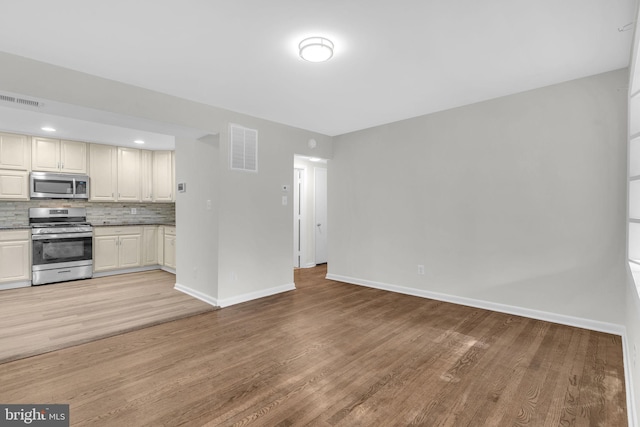 29823 Hillview Dr, Mechanicsville, MD 20659 - kitchen with stainless steel appliances, light wood-style flooring, and baseboards