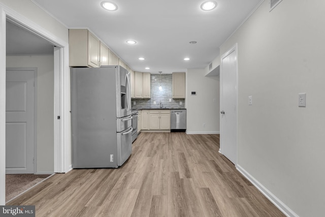 29823 Hillview Dr, Mechanicsville, MD 20659 - kitchen with appliances with stainless steel finishes, light wood finished floors, decorative backsplash, recessed lighting, and a sink