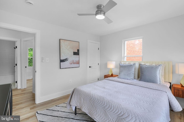 1456 Congress Pl SE, Washington, DC 20020 - bedroom featuring multiple windows, light wood-style flooring, and baseboards