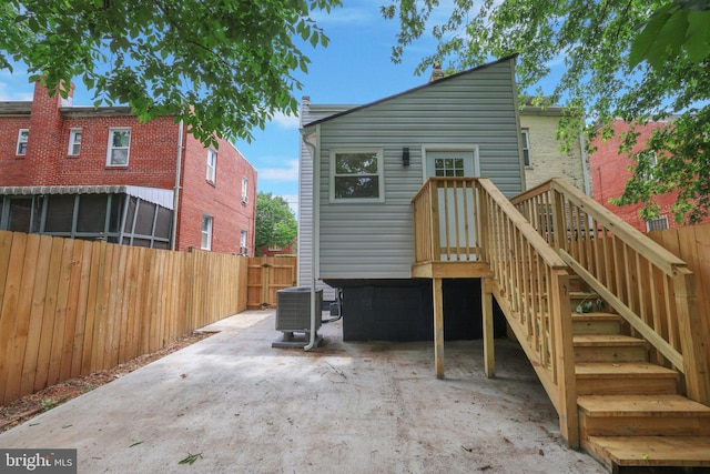 1456 Congress Pl SE, Washington, DC 20020 - rear view of property featuring cooling unit, a patio area, and fence