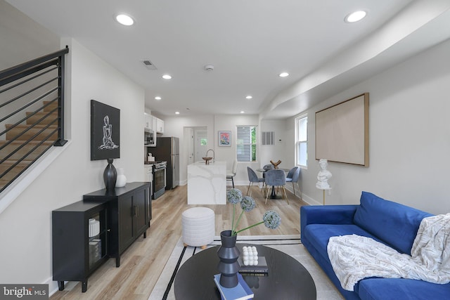 1456 Congress Pl SE, Washington, DC 20020 - living area featuring light wood-style floors, recessed lighting, and baseboards