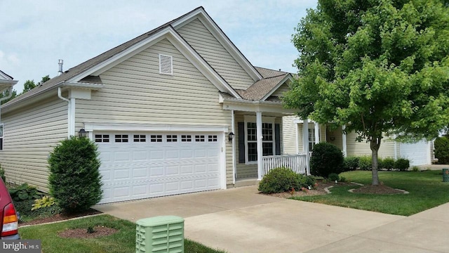 19 Hanover Ct, Fredericksburg, VA 22406 - view of front of property featuring covered porch, a garage, and concrete driveway