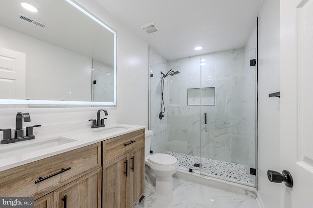 8601 Fort Dr, Manassas, VA 20110 - full bath with marble finish flooring, toilet, a marble finish shower, double vanity, and recessed lighting