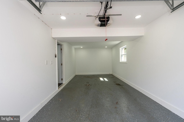 8601 Fort Dr, Manassas, VA 20110 - garage featuring a garage door opener, baseboards, and recessed lighting