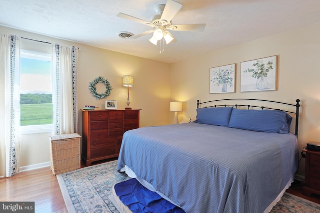 14600 Barton Blvd SW, Cresaptown, MD 21502 - bedroom with wood finished floors, a ceiling fan, and baseboards