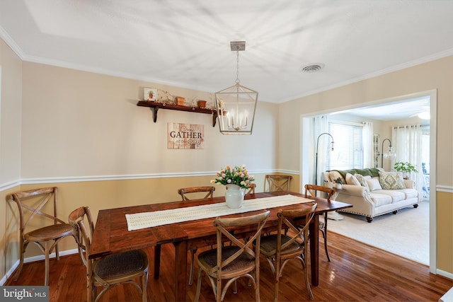 14600 Barton Blvd SW, Cresaptown, MD 21502 - dining room with wood finished floors, crown molding, a chandelier, and baseboards
