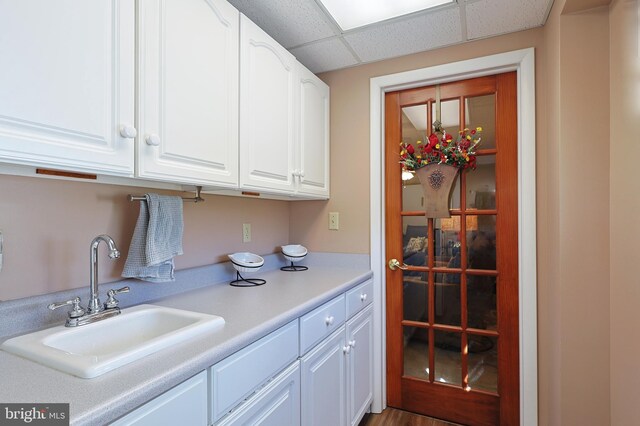 14600 Barton Blvd SW, Cresaptown, MD 21502 - kitchen with a sink, white cabinetry, light countertops, and a paneled ceiling