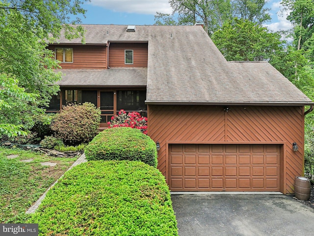 210 Providence Rd, Annapolis, MD 21409 - view of front of house featuring a garage, a shingled roof, and asphalt driveway