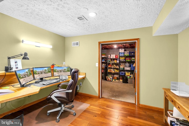 210 Providence Rd, Annapolis, MD 21409 - office featuring hardwood / wood-style flooring, a textured ceiling, and baseboards
