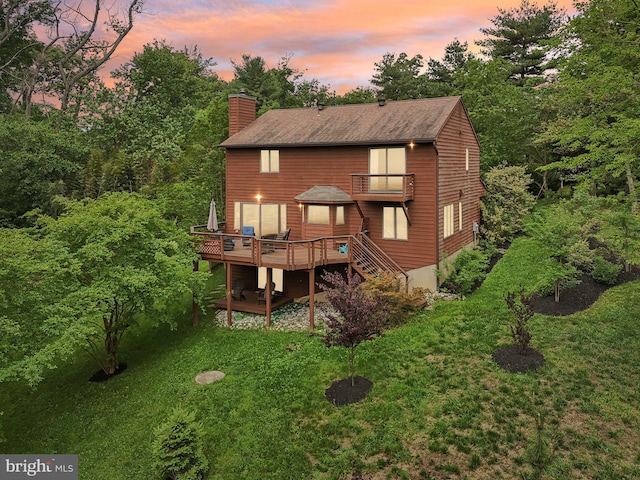 210 Providence Rd, Annapolis, MD 21409 - back of property at dusk featuring a chimney, a balcony, a deck, stairway, and roof with shingles