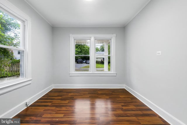 1208 Larchmont Ave, Capitol Heights, MD 20743 - spare room with plenty of natural light, wood finished floors, baseboards, and crown molding