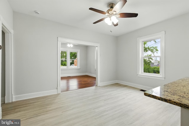 1208 Larchmont Ave, Capitol Heights, MD 20743 - unfurnished dining area with wood finished floors, ceiling fan, and baseboards