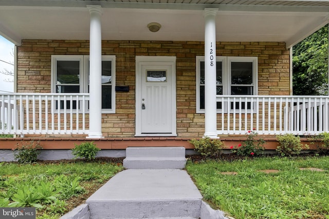 1208 Larchmont Ave, Capitol Heights, MD 20743 - property entrance with a porch and stone siding