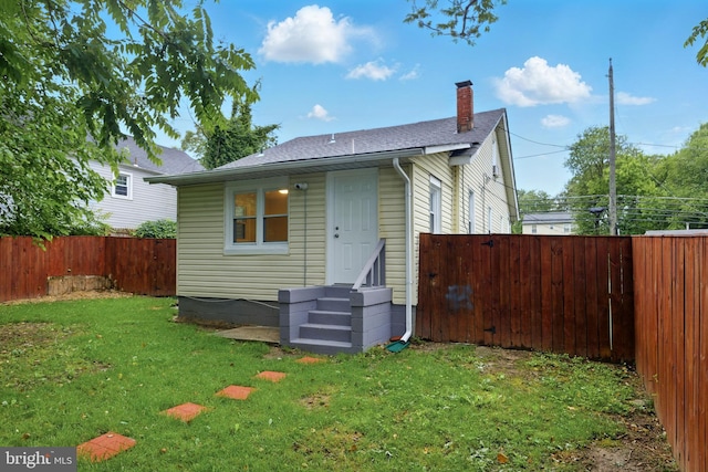 1208 Larchmont Ave, Capitol Heights, MD 20743 - rear view of house featuring a chimney and a shingled roof