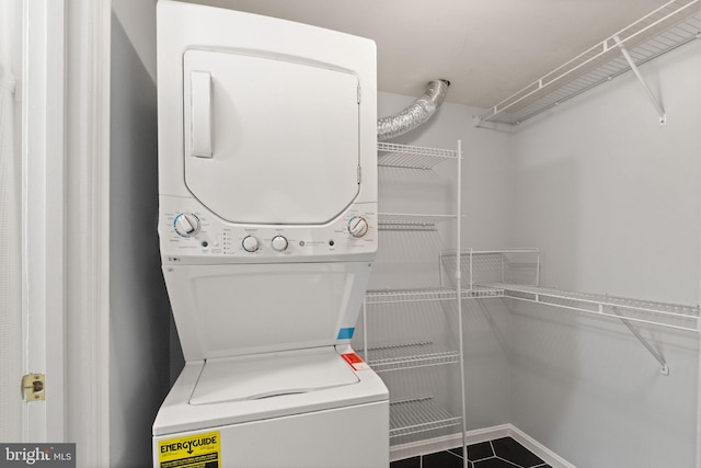 122 N Bedford St Unit A, Arlington, VA 22201 - laundry area featuring stacked washing machine and dryer and dark tile patterned flooring