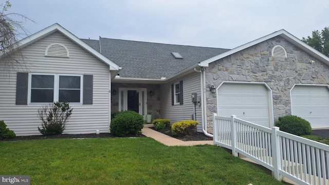 106 Sarah Ct, Lewisberry, PA 17339 - ranch-style home featuring an attached garage, stone siding, a front lawn, roof with shingles, and concrete driveway