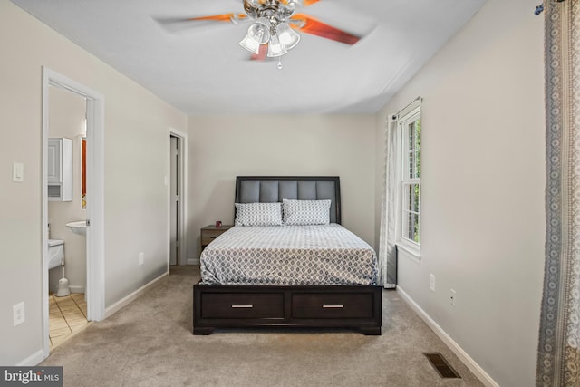 504 Domain Ct, Odenton, MD 21113 - bedroom with light carpet, baseboards, and ensuite bathroom