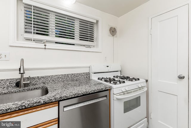 10401 Montrose Ave Unit 10401, Bethesda, MD 20814 - kitchen featuring stainless steel dishwasher, white range with gas cooktop, a sink, and dark stone countertops