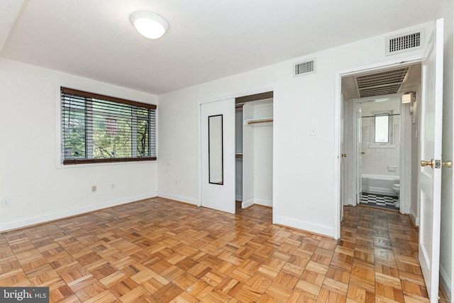 10401 Montrose Ave Unit 10401, Bethesda, MD 20814 - unfurnished bedroom with multiple windows, baseboards, and a closet