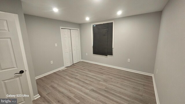 5303 55th Pl, Riverdale, MD 20737 - unfurnished bedroom featuring baseboards, wood finished floors, recessed lighting, and a closet