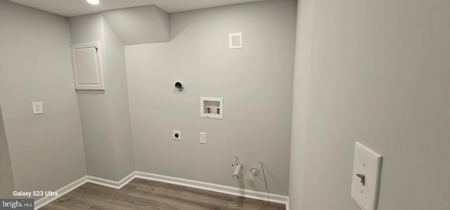 5303 55th Pl, Riverdale, MD 20737 - laundry area with gas dryer hookup, hookup for an electric dryer, hookup for a washing machine, wood finished floors, and baseboards