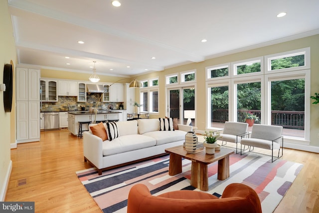 2739 Chesapeake St NW, Washington, DC 20008 - living room featuring ornamental molding, light wood-style floors, and recessed lighting