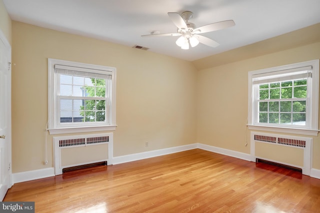2739 Chesapeake St NW, Washington, DC 20008 - spare room with radiator, plenty of natural light, and light wood finished floors